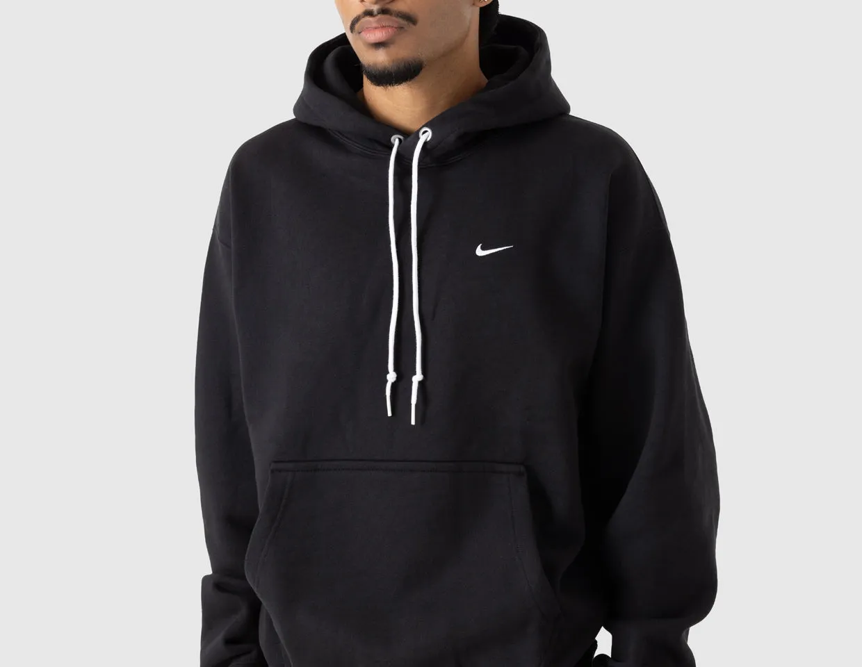 product sustainability impact Nike Solo Swoosh Fleece Pullover Hoodie Black / White