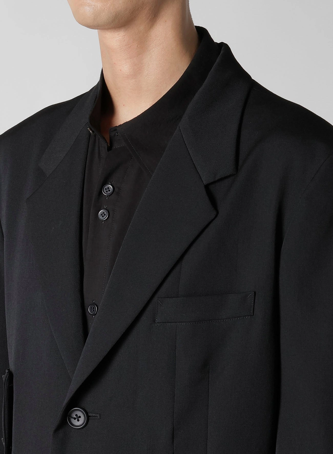 Trophy flight travel WOOL GABARDINE SLEEVE BUTTON ASYMMETRY JACKET